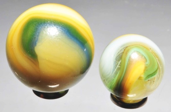 Lot of 2: Akro Marbles.: Includes a light green, yellow and gray Popeye and a larger hard-to-find green, blue, tan and light cream Cork. Size: 3/4" Dia. & 1" Dia.