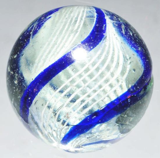 Latticino Ribbon Swirl Marble.: Three outer bands of cobalt under capped with white between and inside of outer bands. Three sets of ribbons, each made up of six white latticino bands. Nice constructions with minor as made hot spots