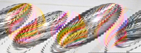 Lot of 3: Divided Core Swirl Marbles.: Group of three multicolored divided core swirls with outer band of latticino. Size: Largest: 1 - 3/4" Dia.