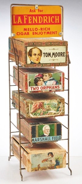 Cigar Box Display and Boxes.: Lot includes La Fendrich metal cigar box display stand with tin litho marquee and five wood cigar boxes including Tom Moore, Two Orphans, Marshall Field and two more. Boxes all have original paper end