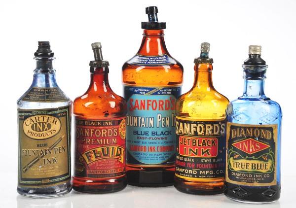 Lot of 5: Ink Bottles.: Fine assortment of old inkbottles including Carter INX Fountain Pen Ink with dispenser top, Diamond Inks True Blue – blue bottle with dispenser top, and three Sandford's Ink Bottles, all amber glass