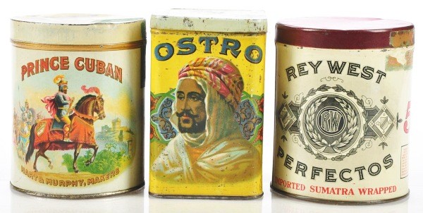 Lot of 3: Cigar Tins.: Nice lot includes upright Ostro Cigar with Arabian man, Prince Cuban with horse and rider, and round Rey West Perfectos. Size: Largest: 5 - 1/2" T.