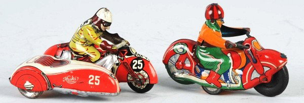 Lot of 2: Tin Motorcycle Friction & Wind-Up Toys.: Includes one German wind-up Huki No. 25 Motorcycle with sidecar and one Japanese friction No. 3 Motorcycle with very nice colorful lithography. Some scratching and wear throughout. Size: Each: 3 - 1/2