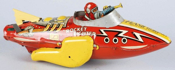 Tin Litho Marx Flash Gordon Rocket Fighter Toy.: American. Wind-up mechanism is working but needs flint to spark. Marked "Flash Gordon King Features Syndicate" on front nose cone. Lithographed figure holding space gun in cockpit. Gun is slightly ben