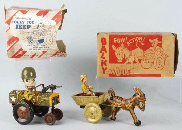 Lot of 2: Tin Litho Marx Vehicle Wind-Up Toys.: American. Includes one Jolly Joe Jeep Whoopee Car with original plastic hat and one Bulky Mule with some scratching and wear. Jolly Joe car is not working and has rust to inside of wheels. Includes bo