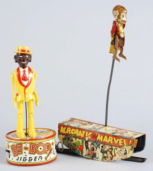 Lot of 2: Marx Character Wind-Up Toys.: American. Working. Includes one Be-Bop Dancing Jigger toy with plastic figure and tin base and one Monkey Acrobat toy. Both have moderate overall wear. Size: Largest: 13" T.
