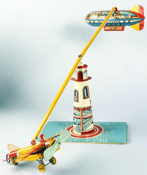 Tin Litho Unique Art Sky Rangers Wind-Up Toy.: American. Working. Comes with wind-up airplane and zeppelin on go-around tin tower. Some scratching and wear to base. Includes original box. Size: Box: 8 - 3/4" x 10 - 1/2" x 7".
