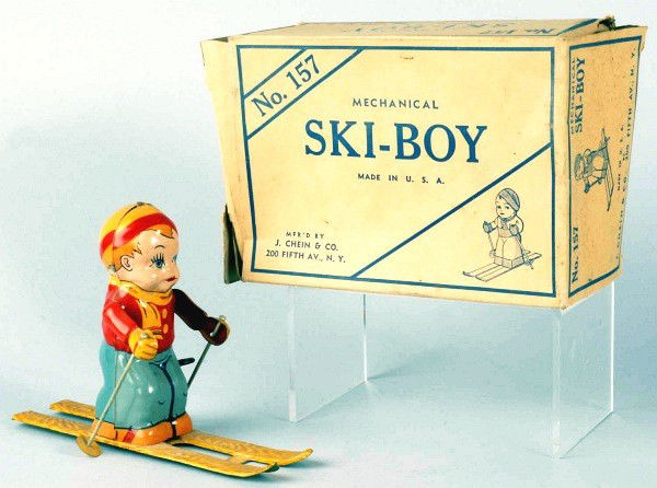 Tin Chein Ski-Boy Wind-Up Toy.: American. Working. Includes original box marked "No. 157 Mechanical Ski-Boy". Box has some creasing and wear. Size: 7 - 3/4" L.