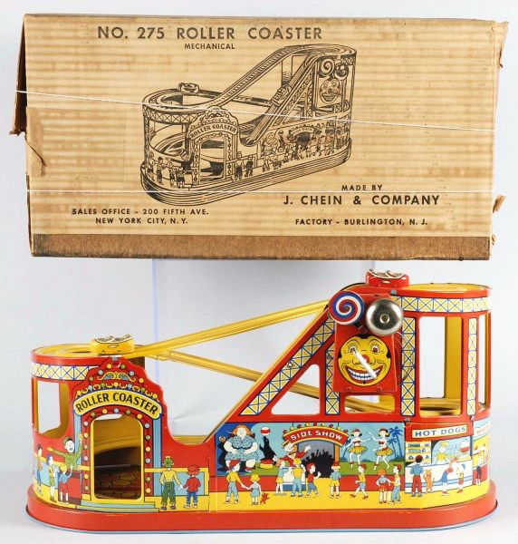 Tin Chein Roller Coaster Wind-Up Toy.: American. Working but needs rubber band adjustment to work properly. Two original cars, one red and one yellow. Nice, clean, bright lithography. Includes crisp original box marked "No. 275 Mechanical
