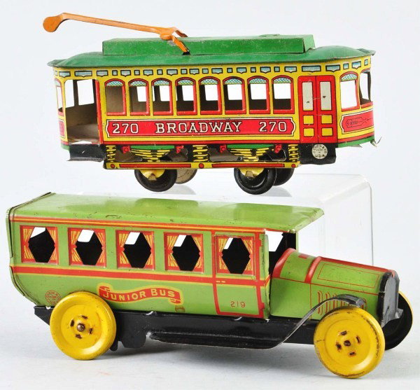 Lot of 2: Tin Litho Chein Vehicle Push Toys.: American. Includes no. 270 Broadway Trolley and no. 219 Junior Bus. Both toys with some denting and scratching to roofs. Size: Largest: 9" L.