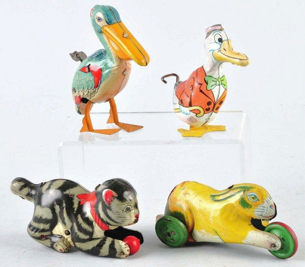 Lot of 4: Tin Litho Chein Animal Toys.: American. Includes one rabbit push toy, one stork wind-up toy, one cat wind-up toy, and one duck wind-up toy. Nice colorful lithography with some overall wear and fading. Size: Largest: 5 - 3/4" L.