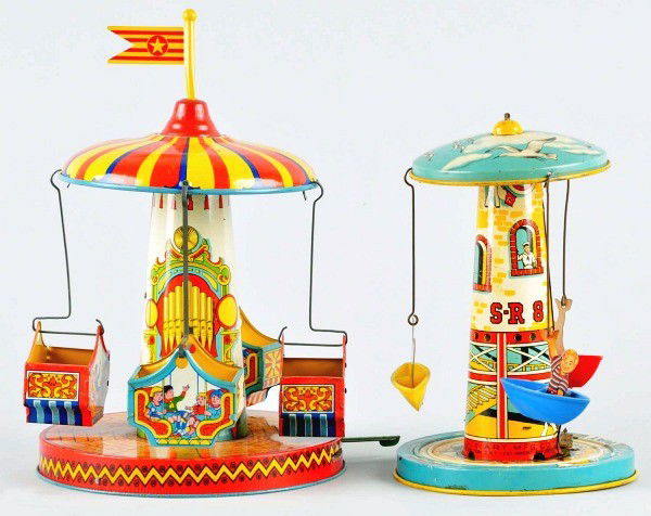 Lot of 2: Tin Litho Ride Lever Activated Toys.: American. Working. Includes Unique Art Lighthouse Boat toy with plastic boats that move around lighthouse. Also includes Chein Flying Swing toy with four lithographed carts that spin around base. Orig
