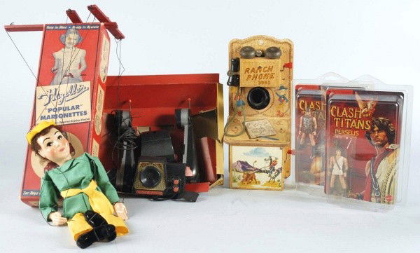 Lot of 6: Miscellaneous Character Items.: Includes Dick Tracy Wrist Radio. Remco walkie talkies in original box without lid, Robin Hood marionette in original box, Western Ranch phone, and two Mattel Clash of the Titans figures sealed on card