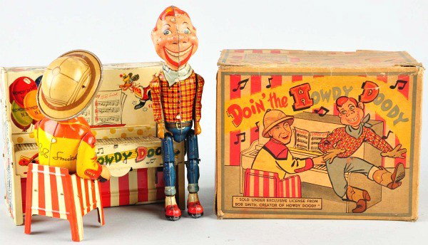 Tin Unique Art Howdy Doody Band Wind-Up Toy.: American. Working. Depicts Howdy Doody and Buffalo Bob at piano. Very little wear overall to toy. Includes complete original box with overall fading, tears, and creasing. Size: 8 - 1/4" T.