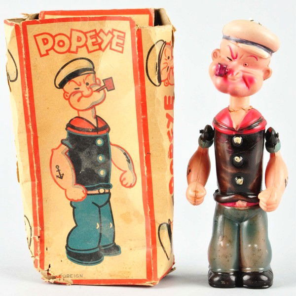 Celluloid Popeye Wind-Up Toy.: Japanese. Working. Possibly made for the English market. When in operation, Popeye's head moves up and down and his arms are movable. No denting or cracking to figure. Includes original box marked "Ki
