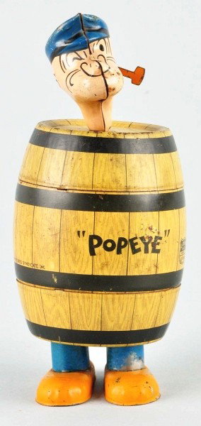 Tin Litho Chein Popeye in the Barrel Wind-Up Toy.: American. Working. Original pipe. Marked "1932 King Featured Syndicate". Some scratching and slight pitting to barrel and one spot of litho loss underneath key area in rear. Size: 7" T.