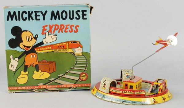 Tin Marx Disney Mickey Mouse Express Wind-Up Toy.: American. Working. Original airplane and original plastic Mickey Mouse pilot. Minor scratching to toy. Includes original box with nice color graphics and some tearing and creasing. Size: 9" Dia.