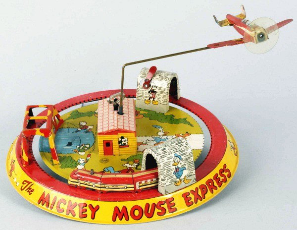 Tin Marx Disney Mickey Mouse Express Wind-Up Toy.: American. Working. Original airplane and nice lithography of several Walt Disney characters around base. Some scratching, wear, and some touchup paint to right wing of plane. Size: 9 - 1/4" Dia.