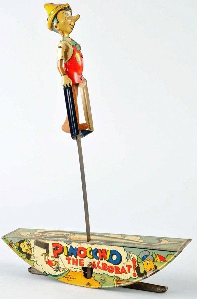 Tin Litho Marx Pinocchio the Acrobat Wind-Up Toy.: American. Working. Pinocchio with pressed cardboard legs. Marked "1939 Walt Disney Productions". Nice lithography around base with Pinocchio characters. Overall scratching and wear. Size: 16" T.