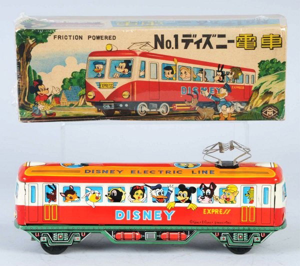 Tin Walt Disney Train Express Friction Toy.: Japanese. Working. Made by Modern Toys. Beautiful color lithography of Disney characters in windows. Very little wear. Includes scarce original and colorful box with Japanese writing. Size: 10" L.