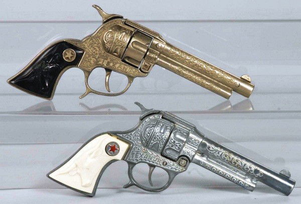 Lot of 2: Hubley Texan Cap Guns.: One is a Texan Jr. and both have fired many caps. Size: Largest: 9 - 1/2" L.