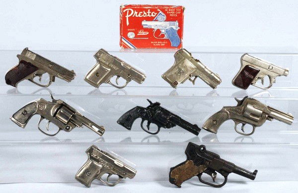 Lot of 9: Assorted Cast Iron Cap Guns.: All are working. Includes original box. Size: Largest: 6 - 3/4" L.