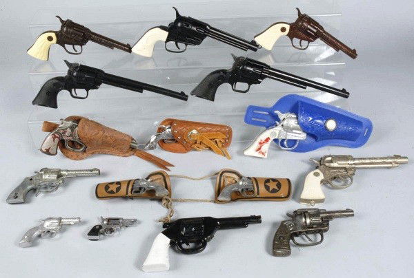 Box Lot of Cap Guns.: Includes Kilgore, Hubley, etc. One Haig gun is working and the other is not. Size: Largest: 13 - 1/2" L.