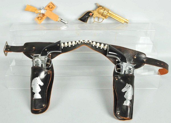 Lot of 3: Gun & Holster Sets.: Includes one Ric O Shay double set with two guns, one working improperly, one Gold Texan set, and one Spitfire set. Size: Largest: 12 - 1/2" L.