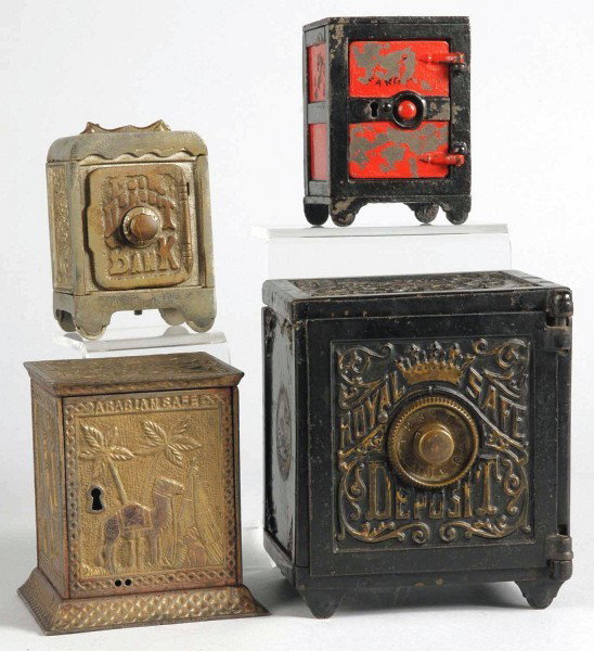 Lot of 4: Cast Iron Safe Banks.: Includes Royal Safe, Arabian, and two generic safe banks. Size: Largest: 6" T.