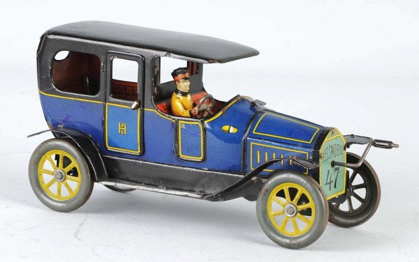 Tin Hess Mobile Limousine Flywheel Toy.: Pre-war. German. Working. Marked "JHL" on back doors and "Hess Mobile" on front grille. Original lithographed driver. Some minor scratching and wear. Some restoration to roof and fenders. Size: 9 - 1/