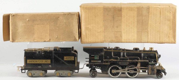 American Flyer Standard Gauge Freight Train Set.: Includes steam engine with matching American Flyer 4693 coal tender, 4017 gondola car with wooden barrels, and 4021 caboose. Engine frame with some pitting and rusting to one side and tender with some
