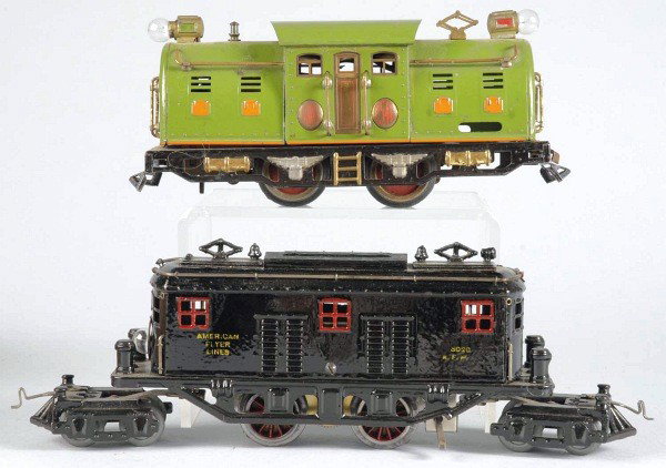 Lot of 2: Lionel & American Flyer Train Engines.: American. O gauge. Includes Lionel 254E electric-style engine with orange hatches and some scratching and wear throughout cab. Also includes American Flyer 3020 electric-style engine with pony trucks 