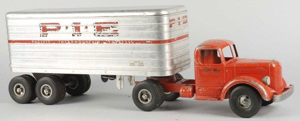 Pressed Steel Smith-Miller P.I.E. Tractor Trailer: American. Original headlights. Pacific Intermountain Express and P.I.E. decals on both sides of trailer with some chipping and wear. Smith-Miller decals on both front side doors with moderate chipping