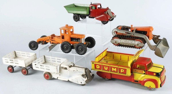 Lot of 5: Diecast & Pressed Steel Vehicle Toys.: American. Includes Lumar pressed steel dump truck, Marx Meadowbrook Dairy truck with trailer, Wyandotte pressed steel dump truck, and two Hubley diecast construction pieces. Some overall scratching an