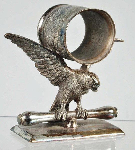 Large Bird Napkin Ring.: Napkin holder rests on outstretched wings. Manufactured by Meriden Britannia Co. Size: 4" T.