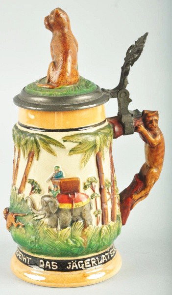 Handled 3/10-Liter Beer Stein.: Handle is in the form of a lion. Depicts a jungle scene with a man on top of an elephant shooting at a lion. Size: 7 - 1/4" T.