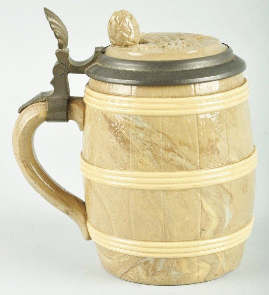 Mettlach Half-Pint Beer Stein.: All original. In the shape of a barrel with an acorn and leaf on top. No breaks or chips. Size: 6" T.