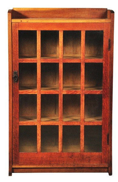 Gustav Stickley Single Door Bookcase.: Refinished. Remnants of paper label on back. Serious split to side. Size: 55 - 1/2" T.