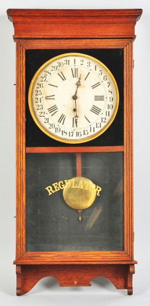 Oak Regulator Time Only Wall Clock.: With pendulum and key. Size: 38 - 1/2" T.