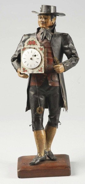 Figural Standing Man Holding Key Wind Clock.: Missing hour hand and key. Size: 15" T.