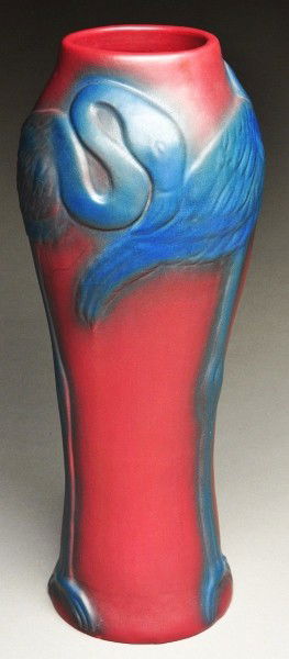 Tall Van Briggle Crane Vase.: Circa 1920s. In a mulberry and blue with glaze over bottom. Some minor grinding chips to base. Size: 20" T.