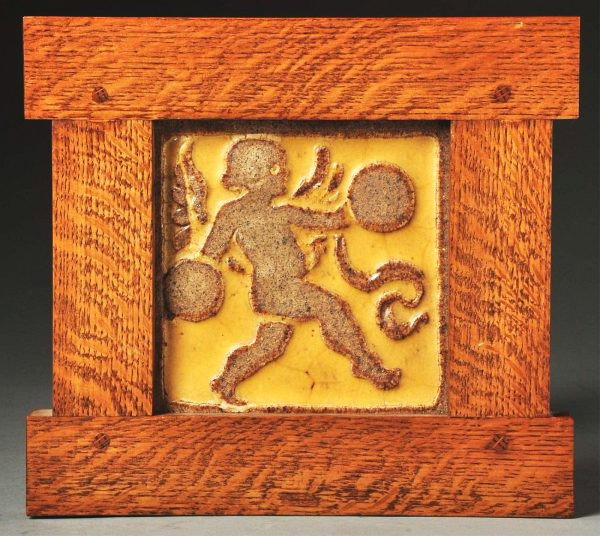 Rookwood 2-Color Faience Tile.: Depicts a boy with symbols in a contemporary, pinned oak frame. Size: Framed: 10 - 1/4" x 9 - 3/4".