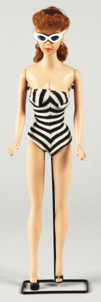 Titian No. 5 Barbie Doll.: 1961 doll with original swimsuit, shoes, sunglasses, and pearl earrings. Includes black wire stand and booklet. (Excellent condition, tiny dot of green at each ear). Size: