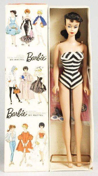 Brunette No. 5 Barbie Doll in Box.: 1961 Ponytail Doll wearing original swimsuit with shoes, earrings, and sunglasses. Includes wire stand. (Excellent condition, faint green spot at ear. Head is on solid torso #4 Barbie body). Size: