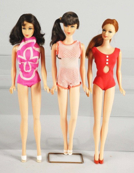Twist & Turn Barbie Doll Lot.: Three Twist and Turn Barbie dolls including Twist 'n Turn Stacey with red hair wearing original swimsuit (pale blue spots at ears, missing some lashes), Brunette Twist 'n Turn Flip hairstyle Barbie do