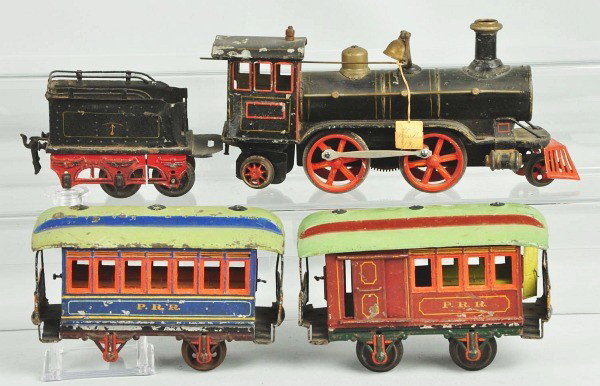 Handpainted Marklin Gauge 1 Passenger Train Set.: German. Includes American Outline 242 locomotive, six wheel tender, two Pennsylvania Railroad passenger cars, one baggage car, and one combine car. Tender is rare because its back four wheels swivel. 