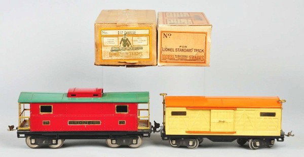 Lot of 2: Lionel Freight Train Cars.: American. Standard gauge. Includes 217 caboose and 514 boxcar. Caboose with some wear to roof. Includes both original boxes. Size: