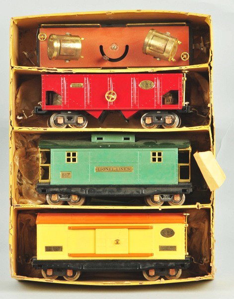 Lionel O Gauge Freight Car Gift Pack.: American. Pre-war. Set of four includes 814 boxcar, 816 hopper car, 817 caboose, and 820 floodlight car. Slight oxidation to some wheels and floodlights. Includes original box with missing lid. Size: