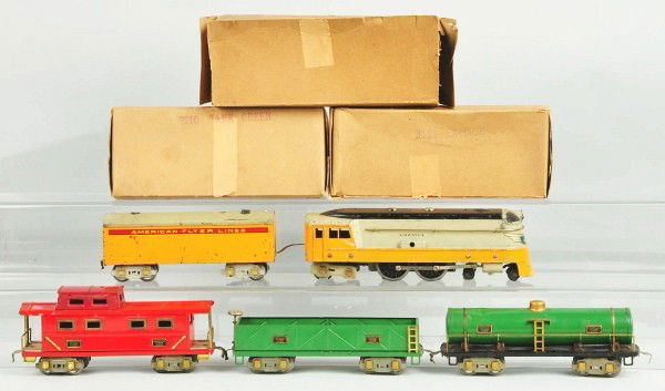 American Flyer O Gauge Hiawatha Freight Set.: Pre-war. Complete with green tank car, two tone red caboose, and green gondola car. Locomotive and tender painted in the orange and grey Hiawatha colors. Some repaint to black on locomotive roof. Incl