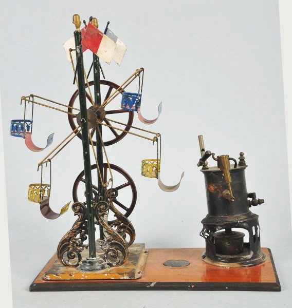 Tin E.P. Ferris Wheel Steam Operated Toy.: Very early toy on platform with E.P. (Ernst Plank) emblem. Toy depicts a ferris wheel with five gondolas, one of which is missing. Nice filigree on bottom of base. Toy is missing figurines and one fla